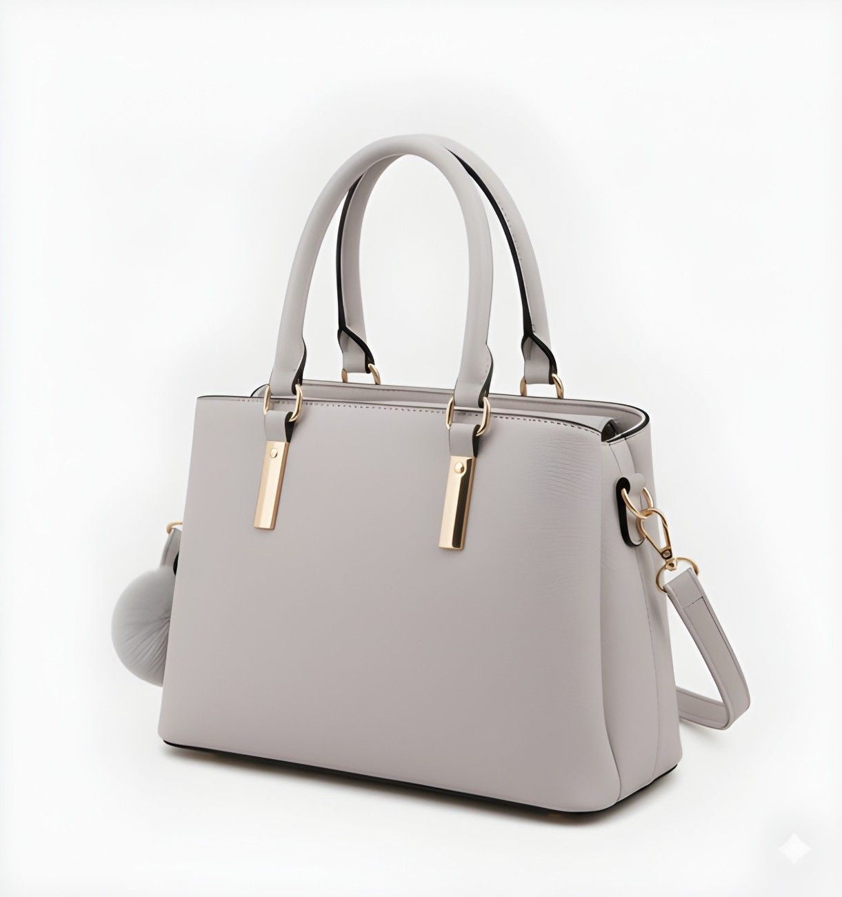 Gray handbag with gold accents on a white background