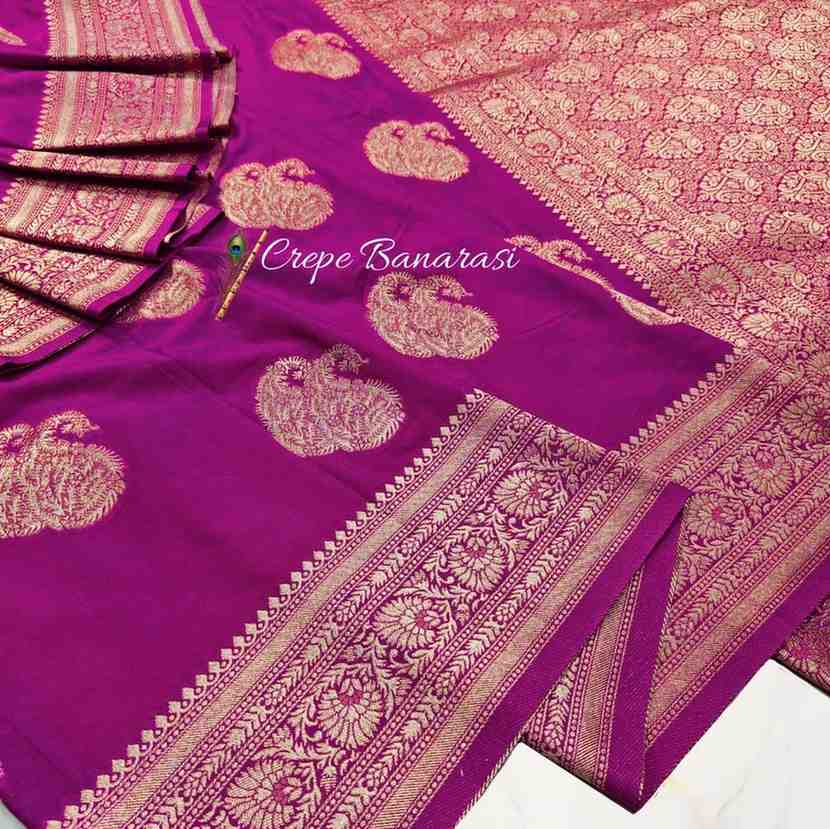 Purple saree with gold patterns and 'Crepe Banarasi' branding.