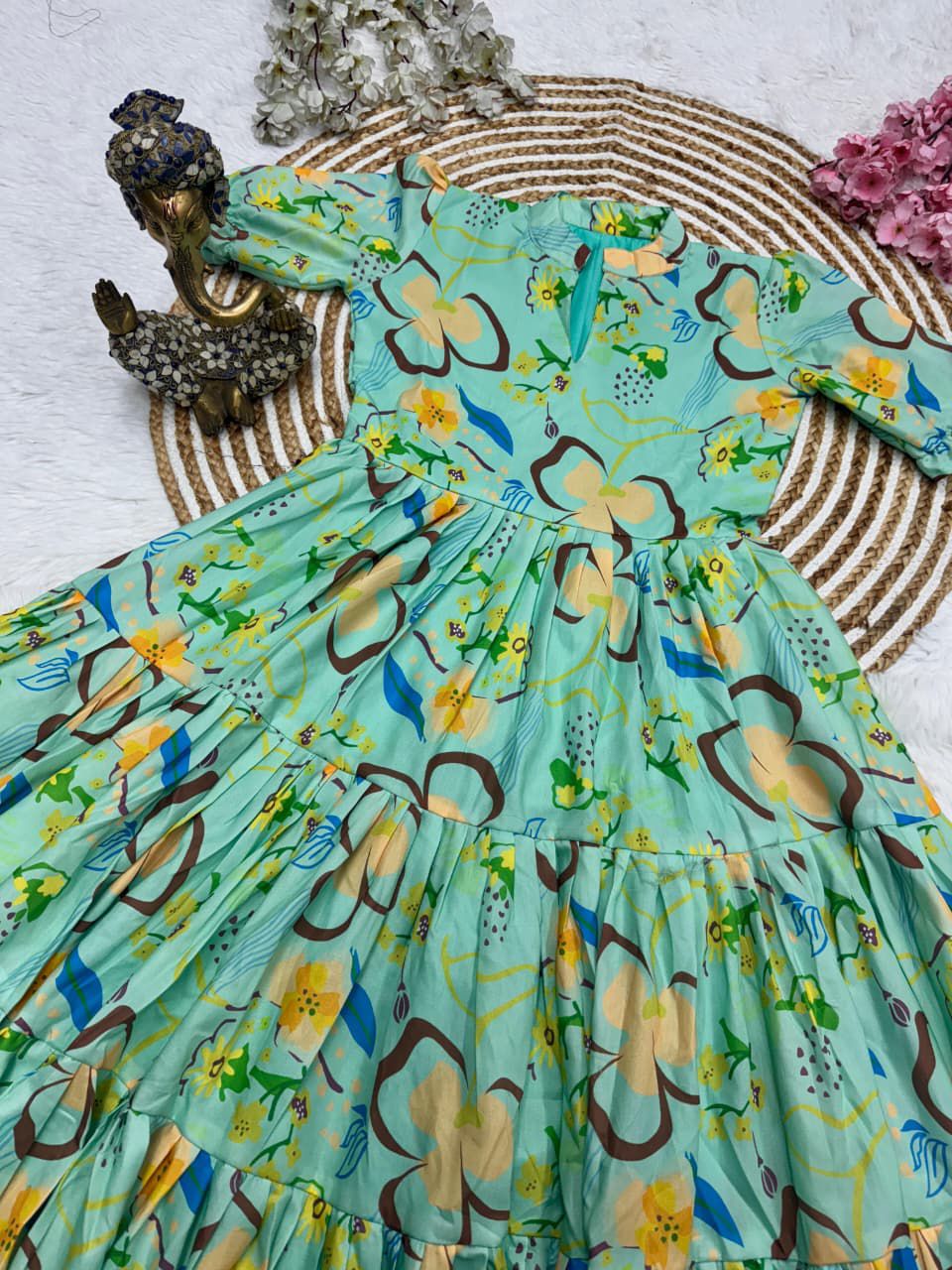 Colorful dress with butterfly pattern on a textured surface