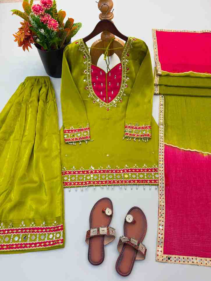 “Women’s green kurti set with embroidered neckline, palazzo and pink dupatta”