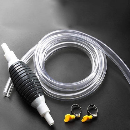 Clear hose with black and white pump and three connectors on a dark surface