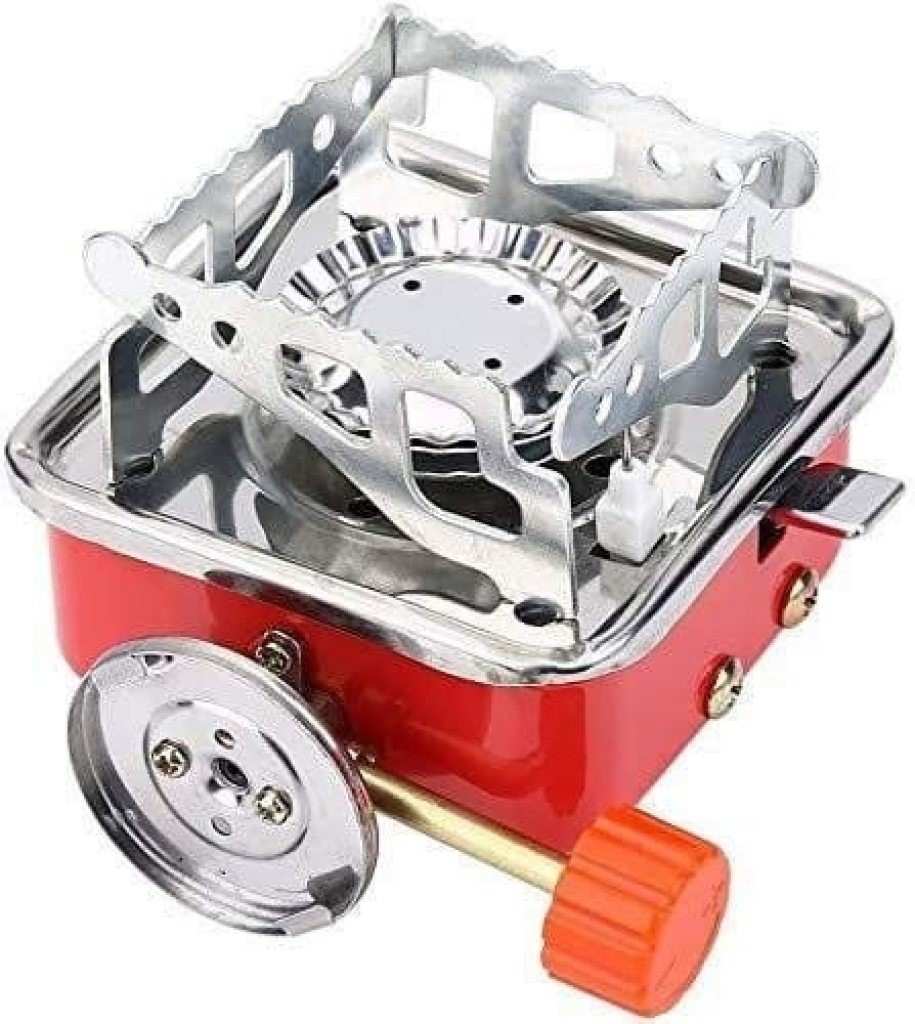 Portable gas stove with red base and silver top on a white background