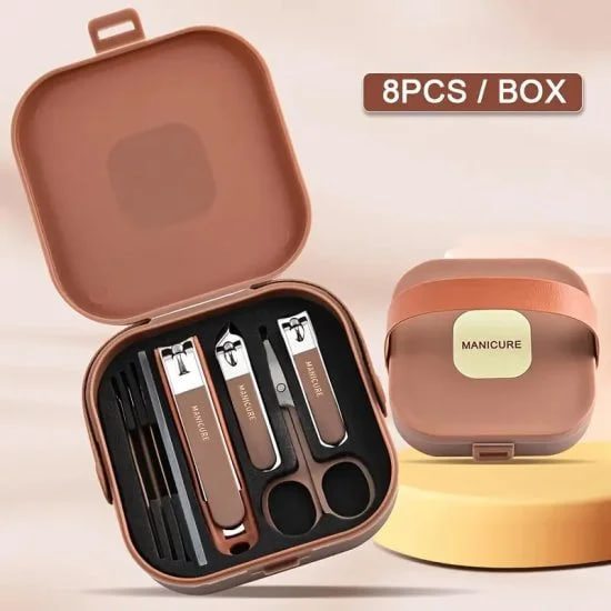 Manicure set with tools in a brown case on a beige background