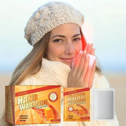 Woman wearing a knit hat and scarf with hand warmers, including a box of JaySung hand warmers.