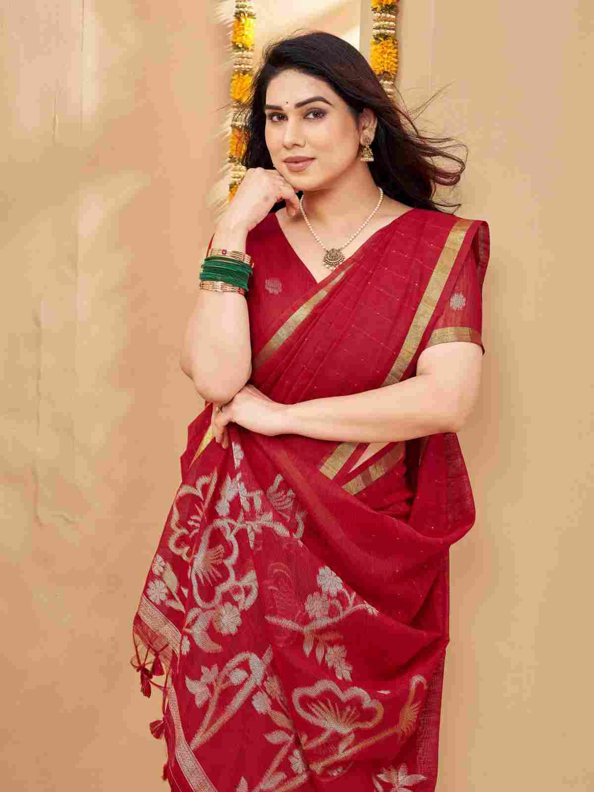 Close-up of red saree pallu with floral zari weave.