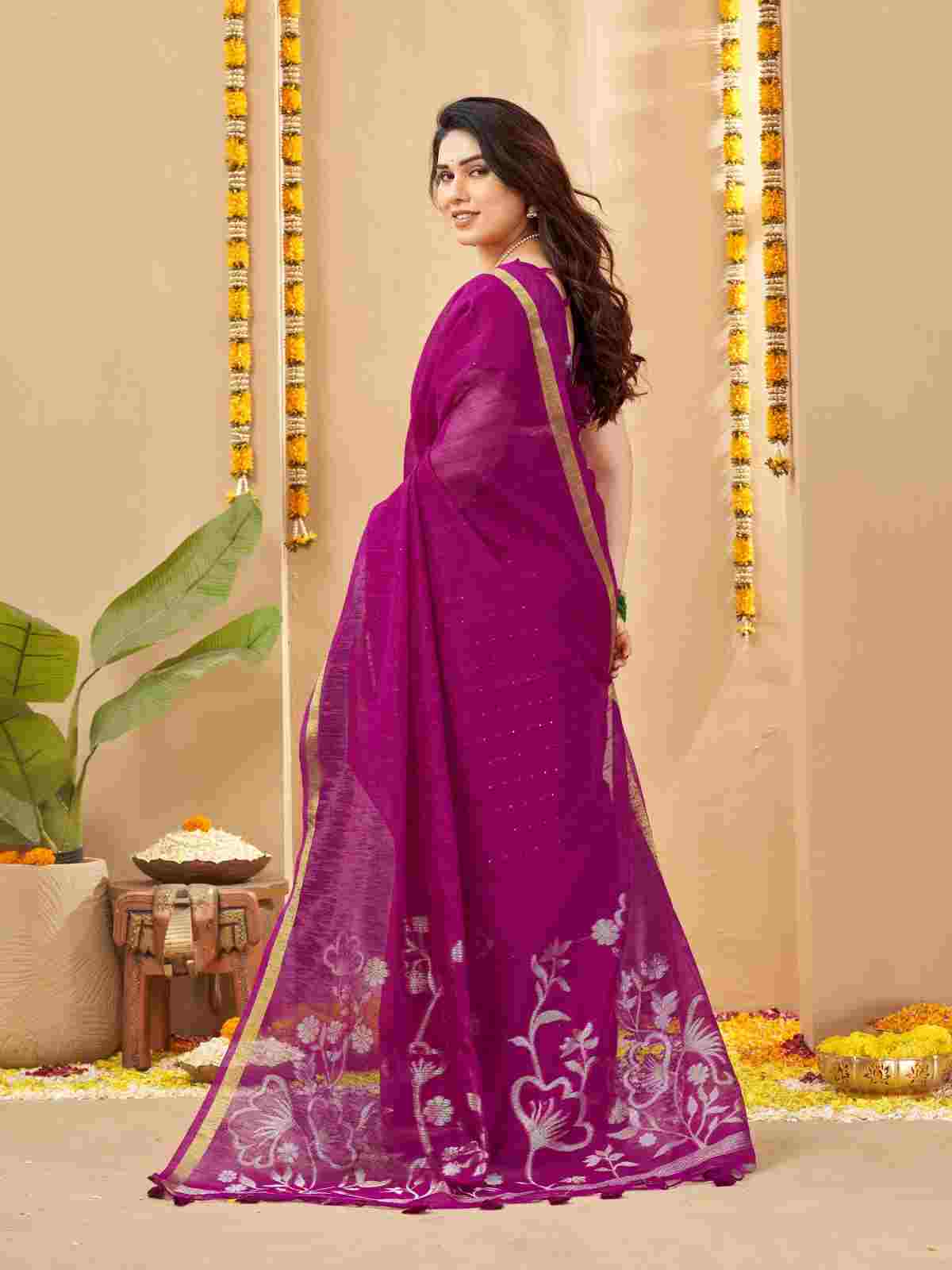 Back view of woman draped in magenta linen silk saree.