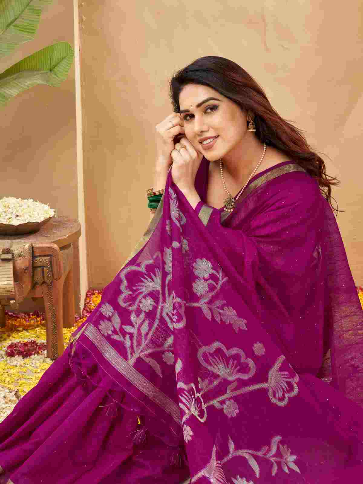 Close-up highlighting magenta saree pallu with floral zari weave.