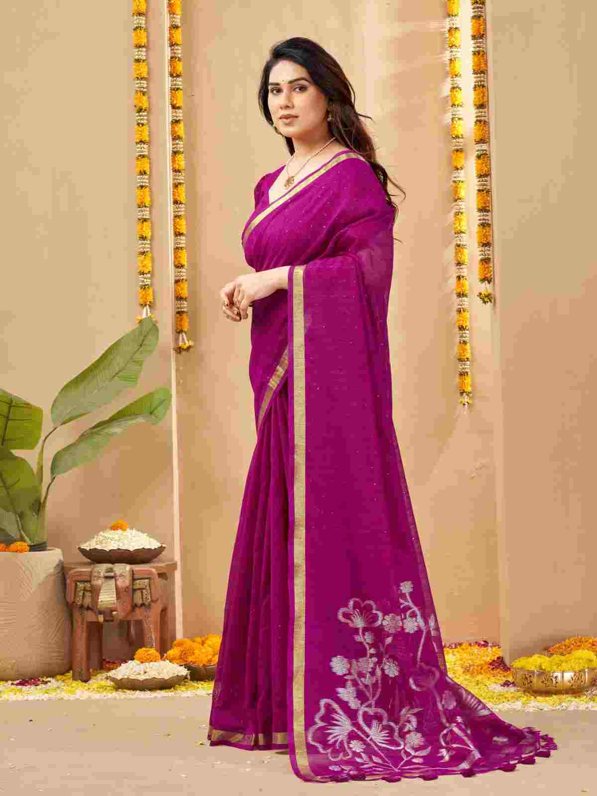 Magenta linen silk saree showing silver zari floral motifs.