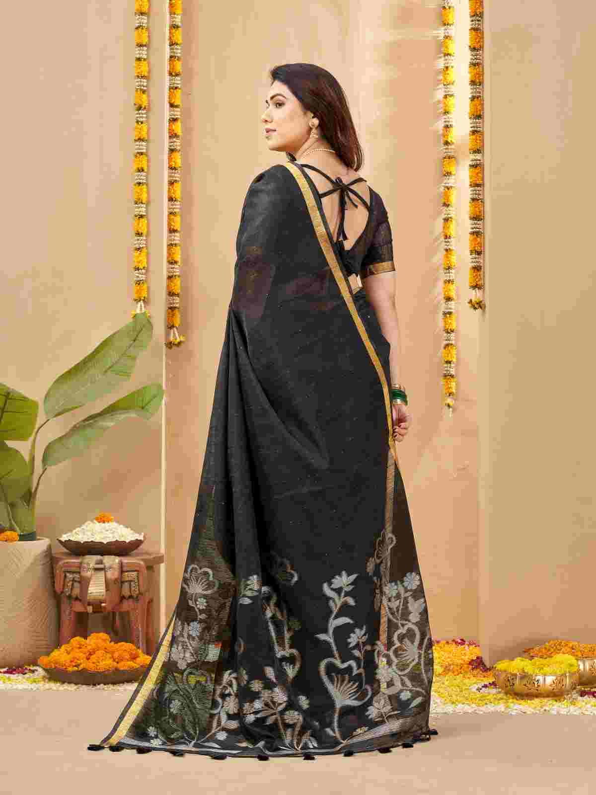 Back view of draped linen silk saree showing tie-up blouse style.