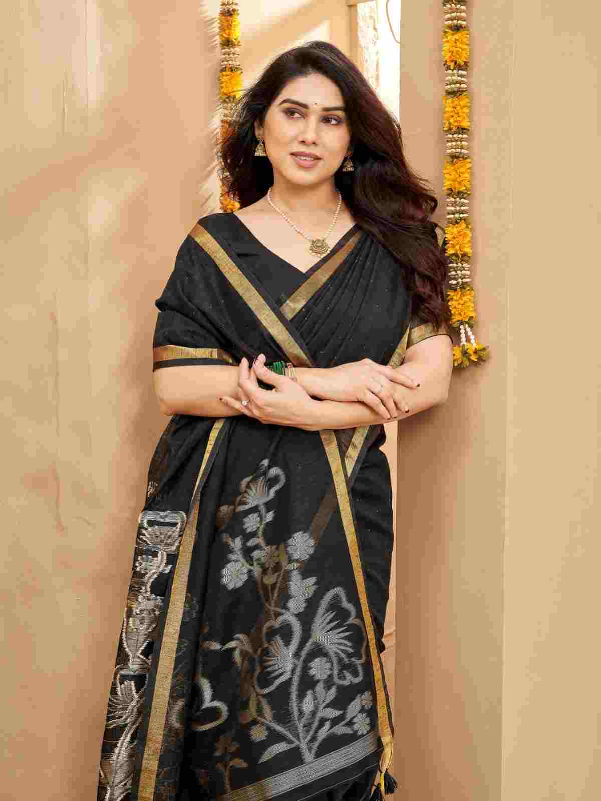 Half-length view of model draped in zari linen silk saree.