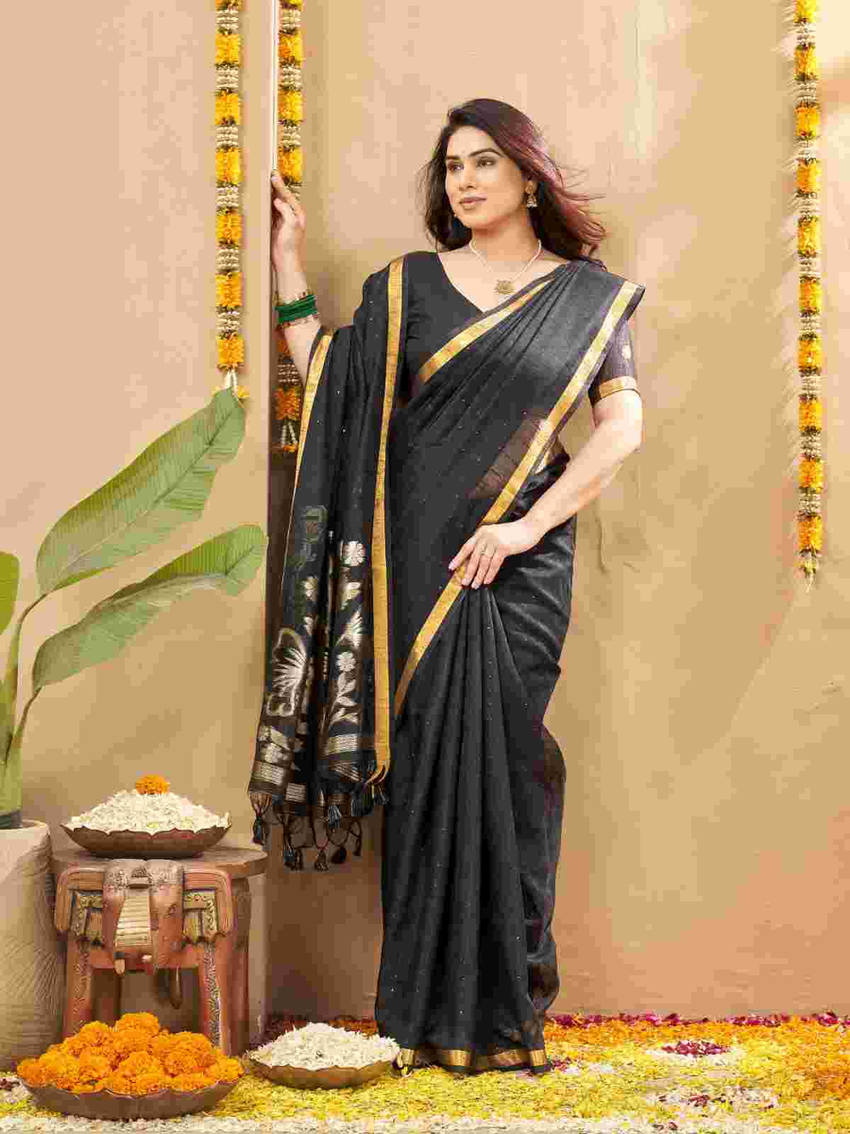 Standing pose of model in woven zari linen silk saree.