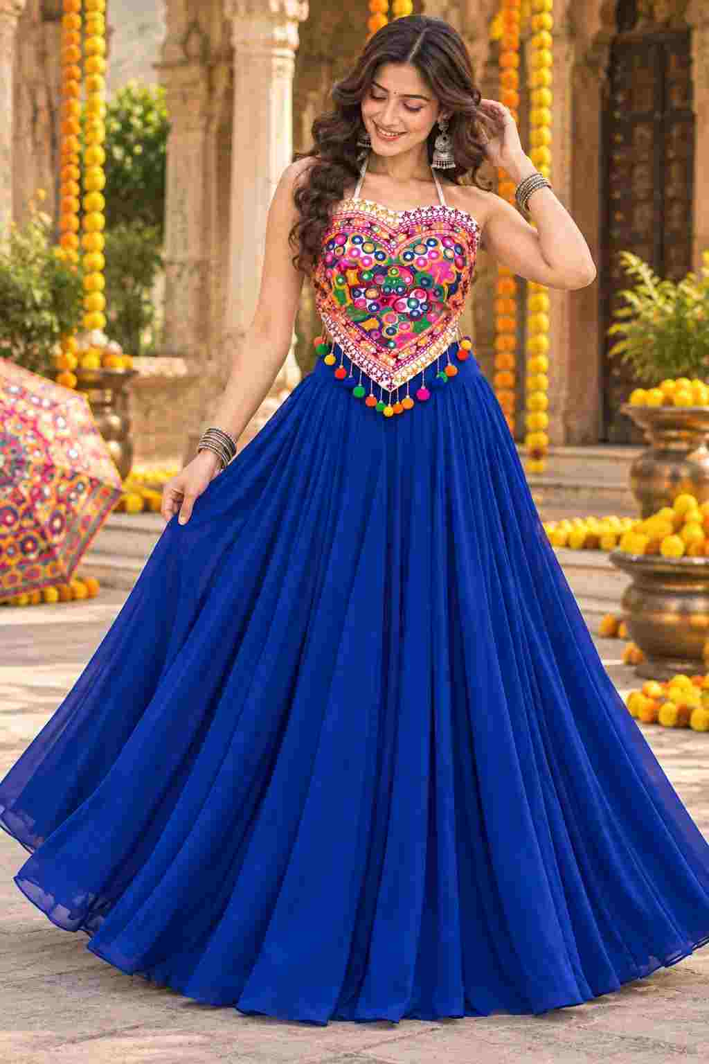 Front view of blue georgette Navratri lehenga choli with mirror work top.