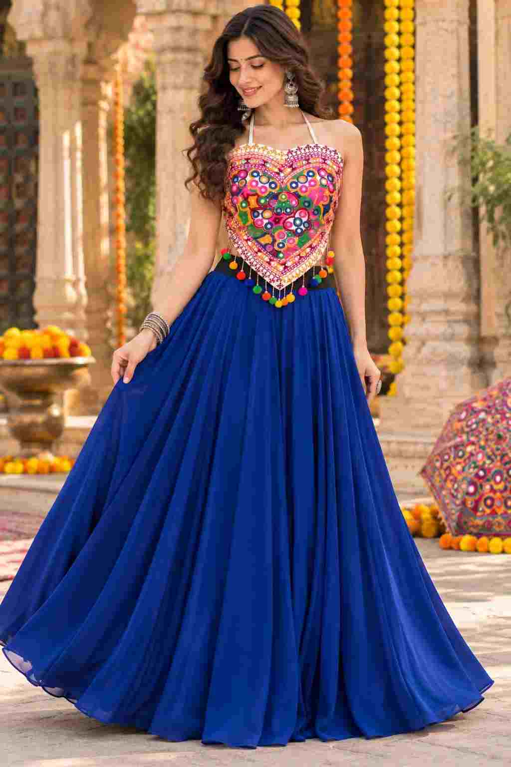 Standing front view of blue cotton georgette Katchi mirror lehenga choli.