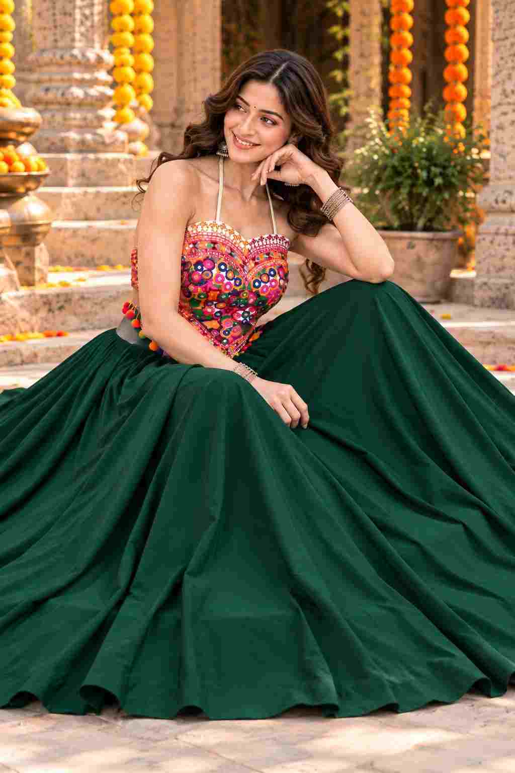 Sitting in dark green cotton georgette Katchi mirror lehenga choli.
