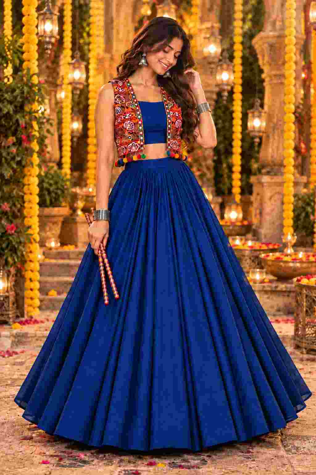 Front view of a royal blue Navratri lehenga choli with a mirror jacket.