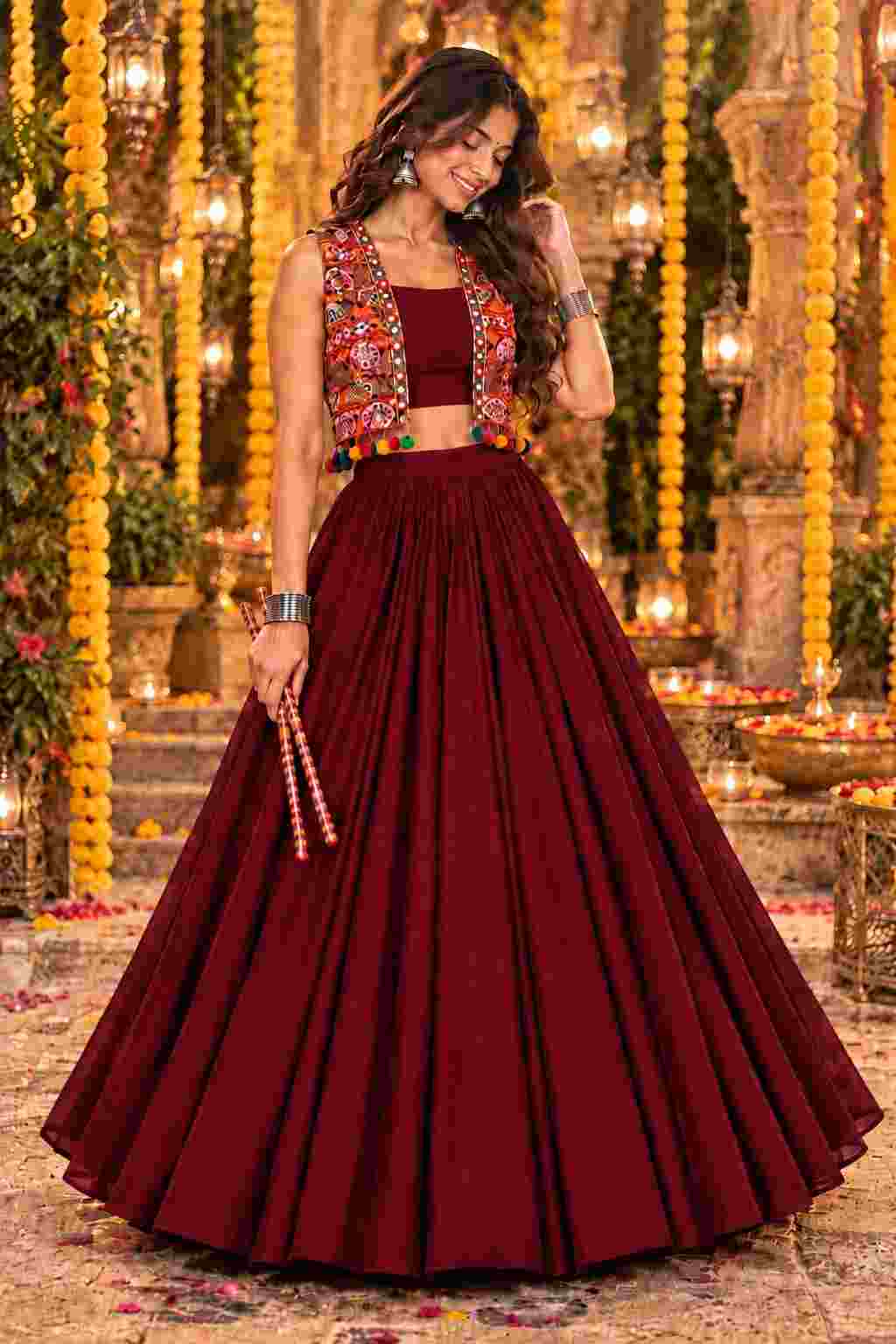 Front view of a maroon lehenga set with an embroidered jacket.