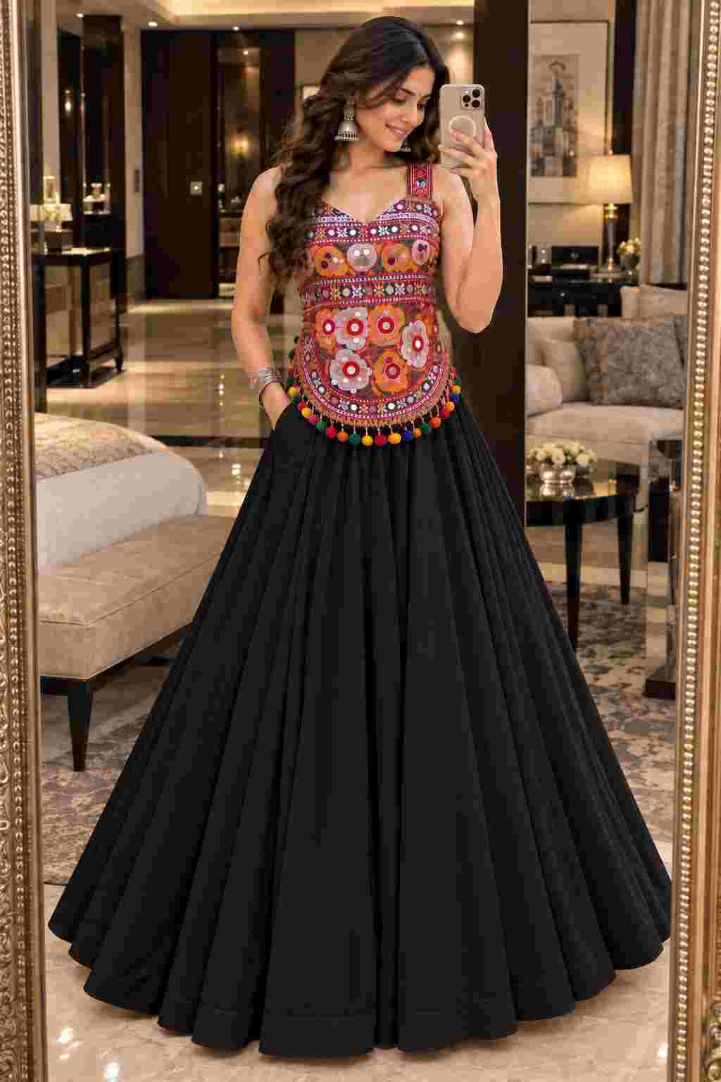 A black Navratri lehenga with a colorful embroidered mirror-work choli. 