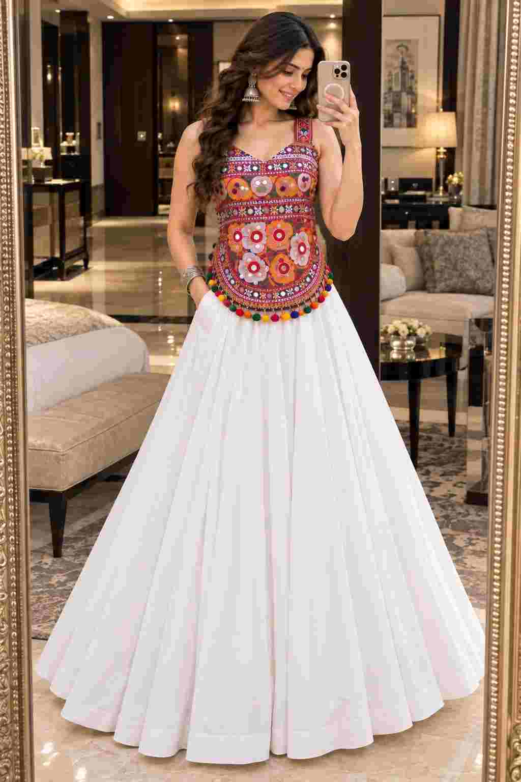 A white Navratri lehenga with an embroidered mirror-work choli and side pockets