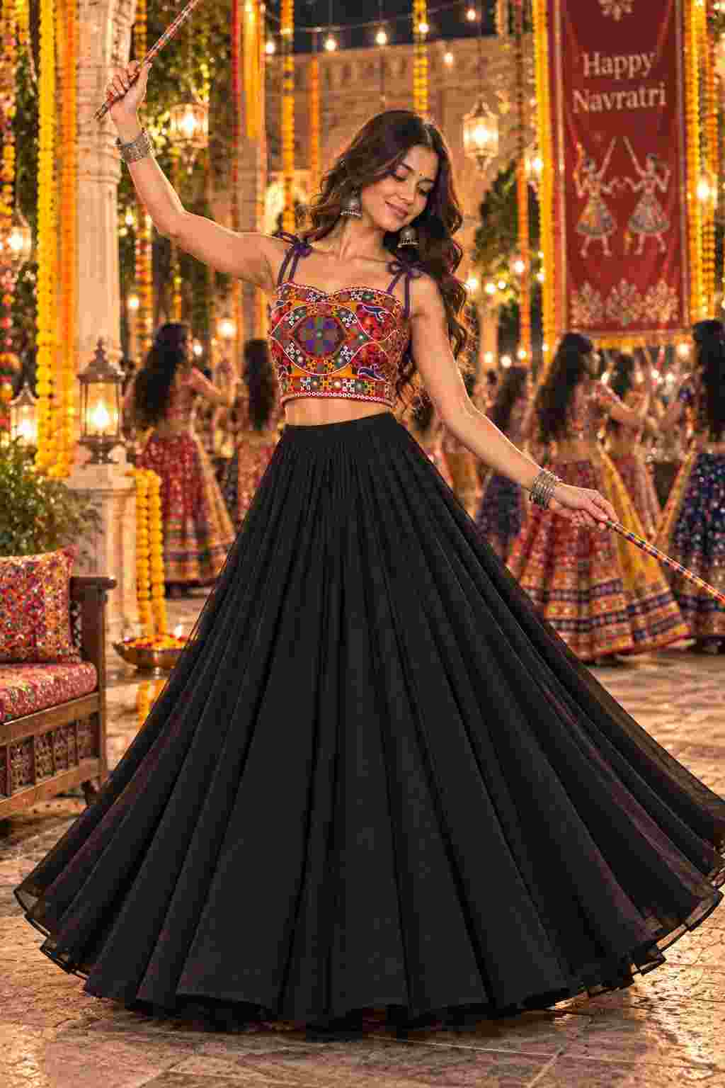 Black lehenga and embroidered mirror-work choli.   