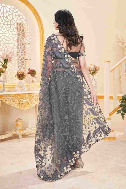 Elegant net saree embellished with decorative stone work