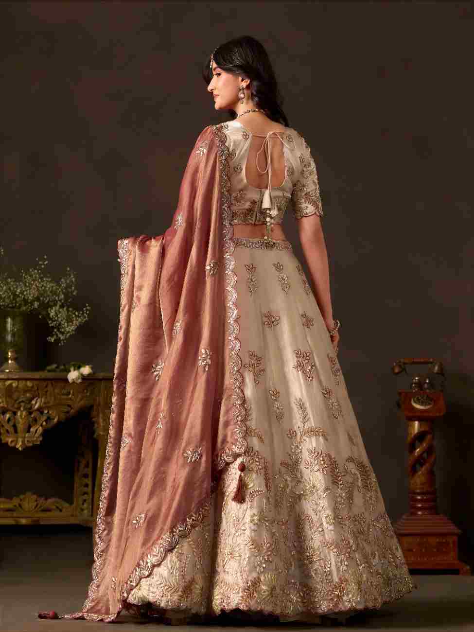 Traditional festive outfit featuring thread and zari work