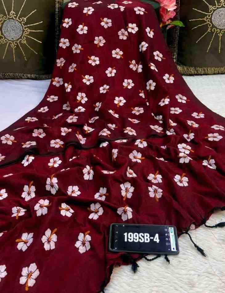 Maroon fabric with white floral patterns draped over a surface.