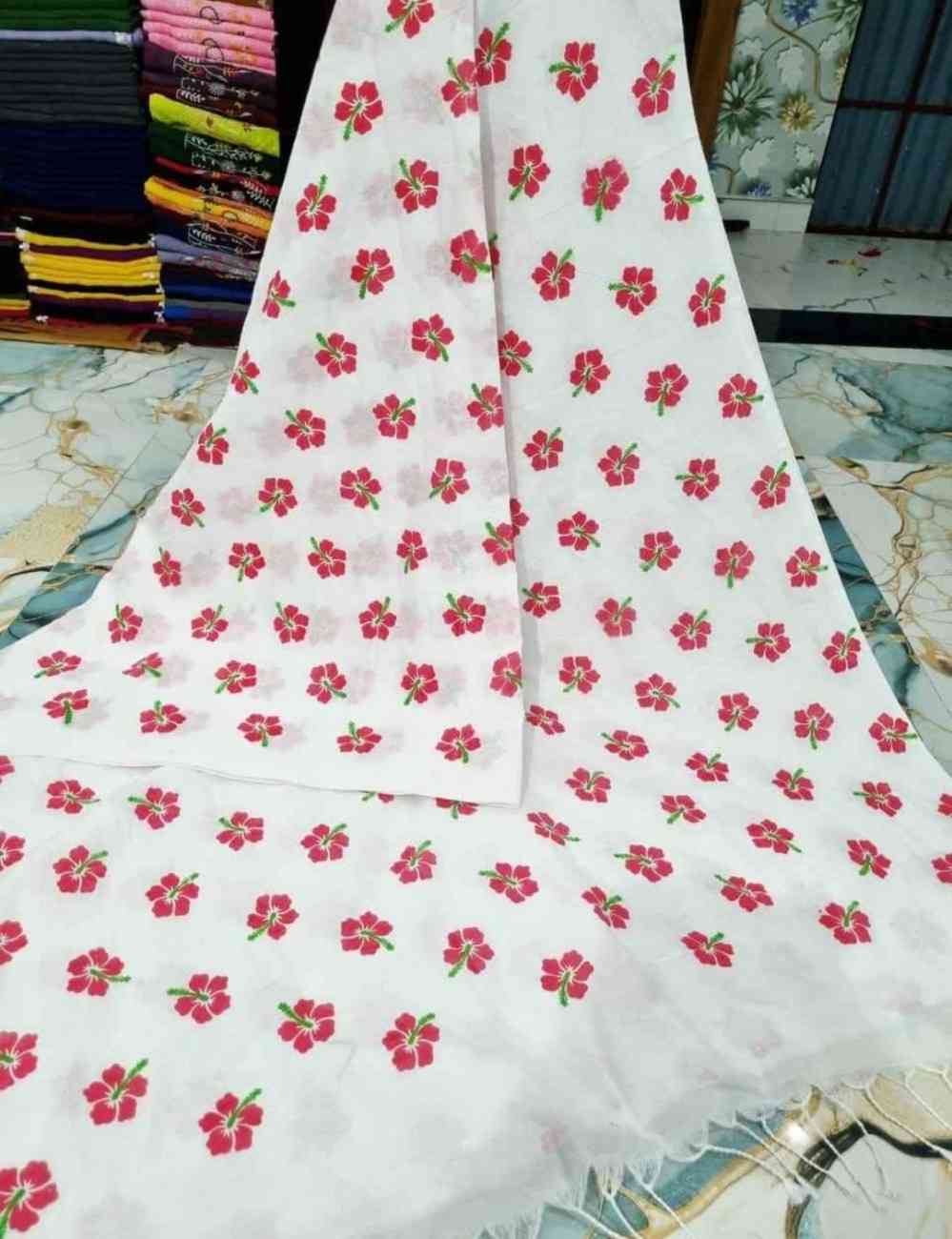 Floral-patterned fabric on a table with a colorful background