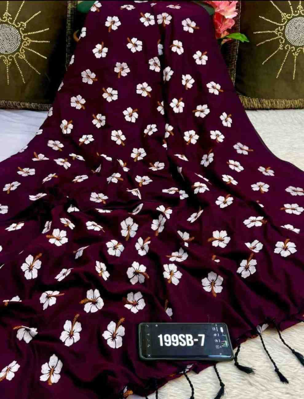Maroon fabric with white floral pattern on a textured surface