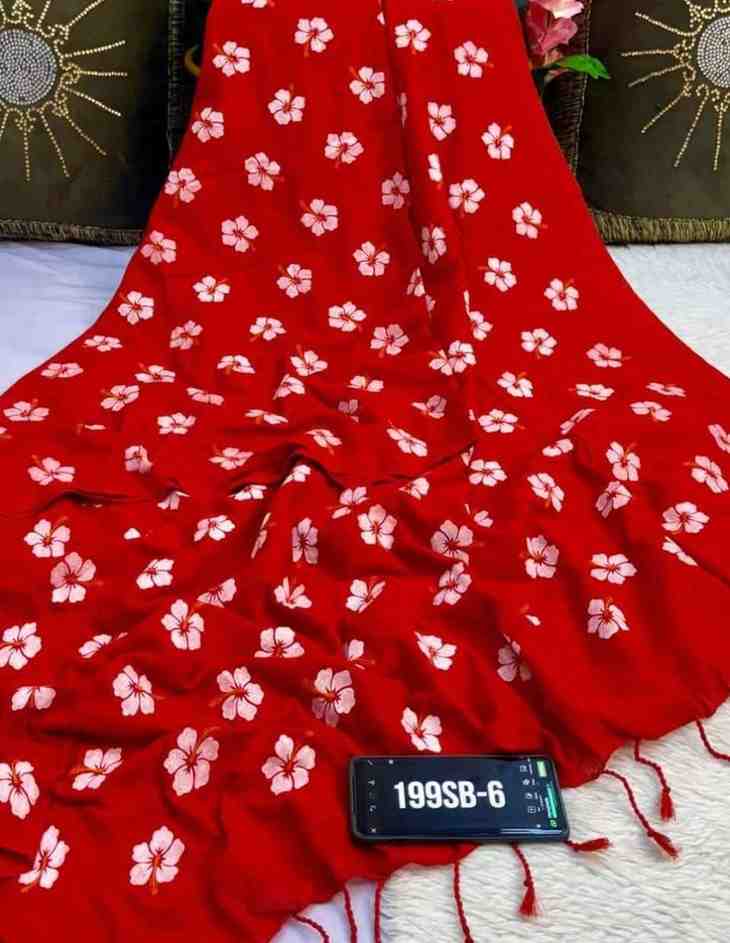 Red fabric with white floral patterns draped over a surface, with a phone displaying '199SB-6' in the foreground.