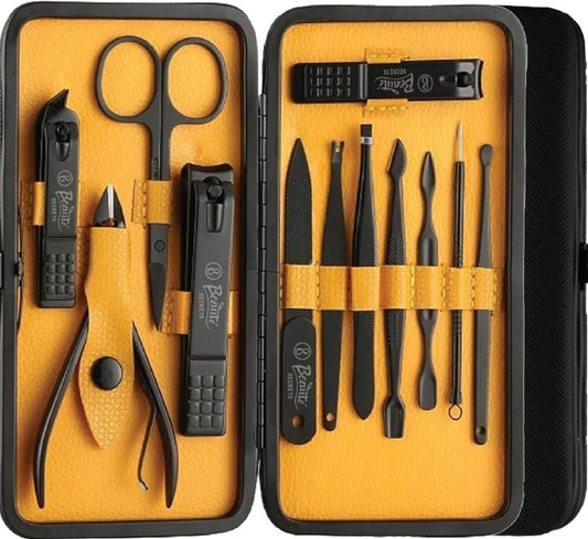 Manicure set with tools including scissors and nail clippers in a black case on a yellow background.
