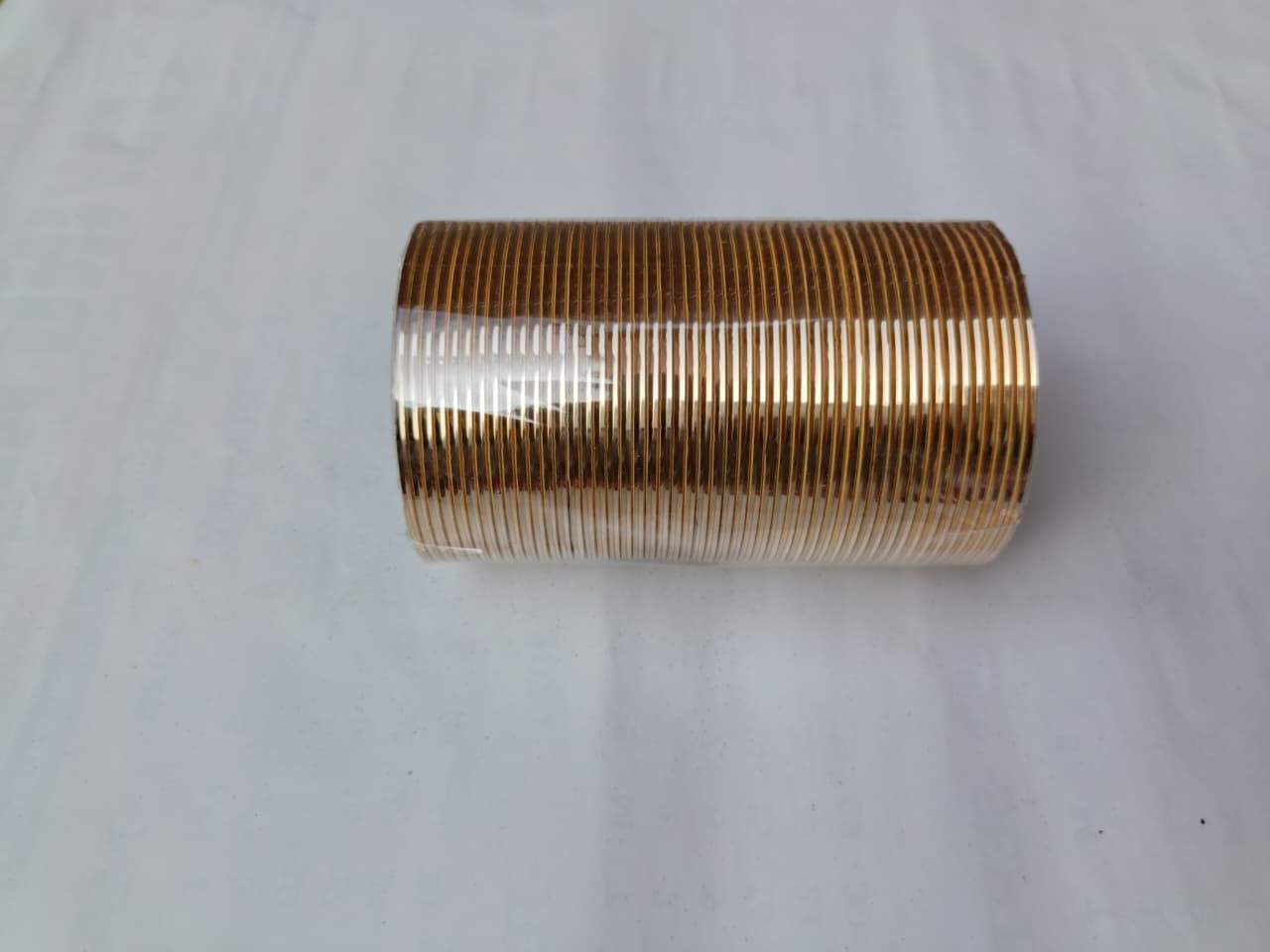 Coiled copper wire on a white background