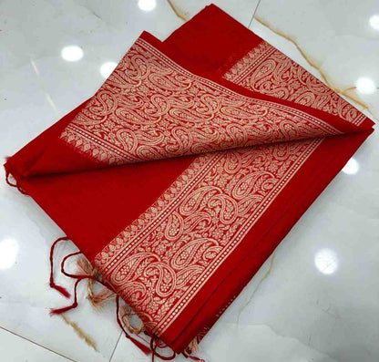 Red fabric with white patterns on a white surface