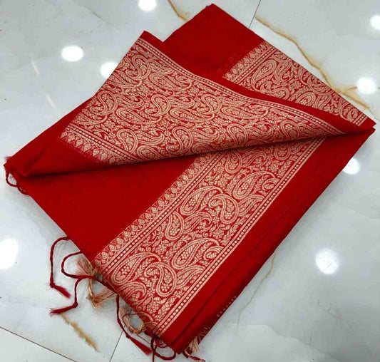 Red fabric with white patterns on a white surface