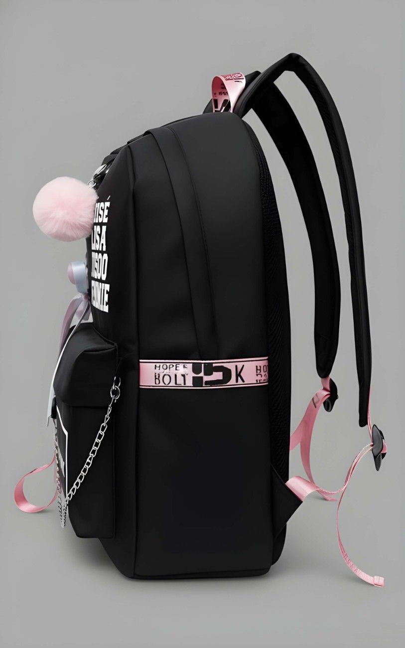 Black backpack with pink accents and decorative elements on a gray background