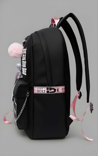 Black backpack with pink accents and decorative elements on a gray background