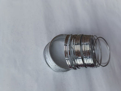 Metallic bracelet on a light gray background