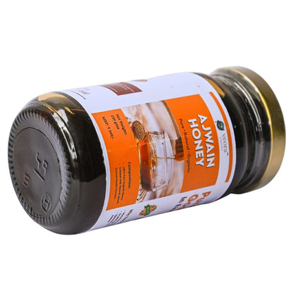Jar of Ajwain honey with a label on a white background