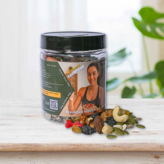 Jar of 'Breakfast Super' mix with a woman on the label, surrounded by various nuts and seeds on a wooden surface.