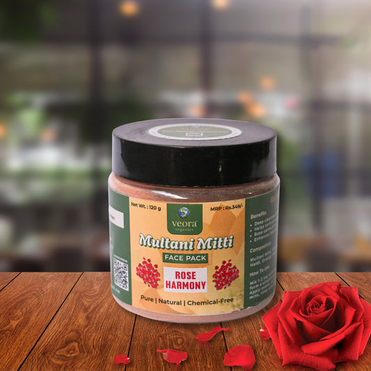 Veora Multani Mitti Face Pack jar with a red rose on a wooden surface