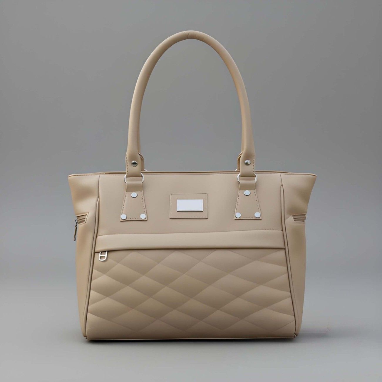 Beige quilted handbag on a gray background