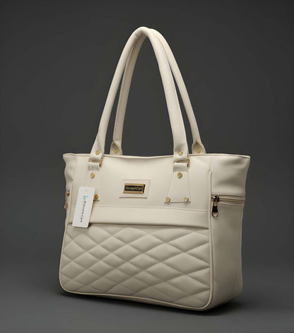 Beige quilted handbag with a visible brand label on a dark background