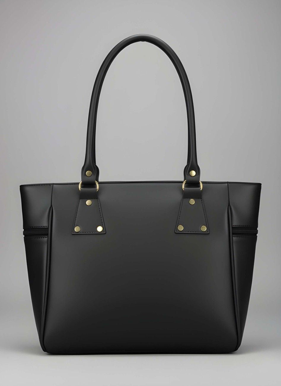 Black handbag with gold accents on a gray background