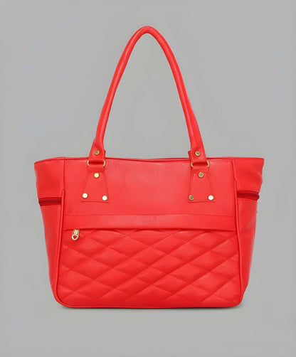 Red quilted handbag on a gray background