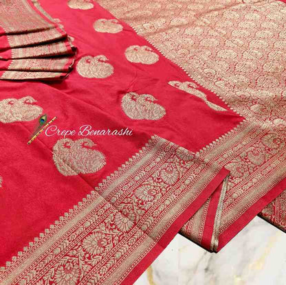 Red saree with gold patterns and 'Crepe Benarashi' branding.
