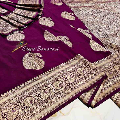 Purple saree with gold embroidery and 'Crepe Banarasi' text