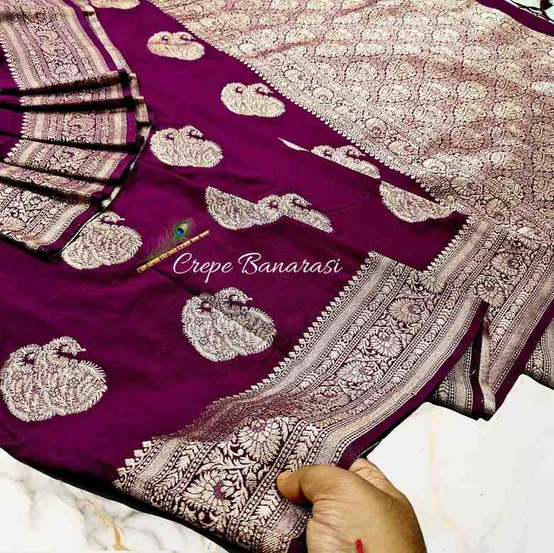 Purple Crepe Banarasi saree with white embroidery on a white background