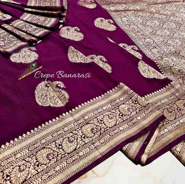 Purple saree with gold embroidery and 'Crepe Banarasi' text