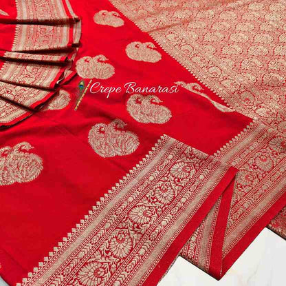Red Crepe Banarasi saree with white floral patterns on a white background