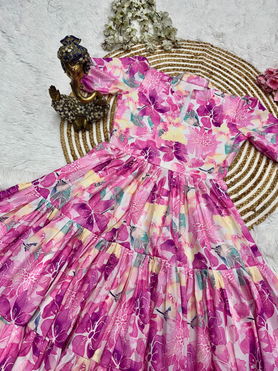 Pink floral dress on a white background with decorative elements