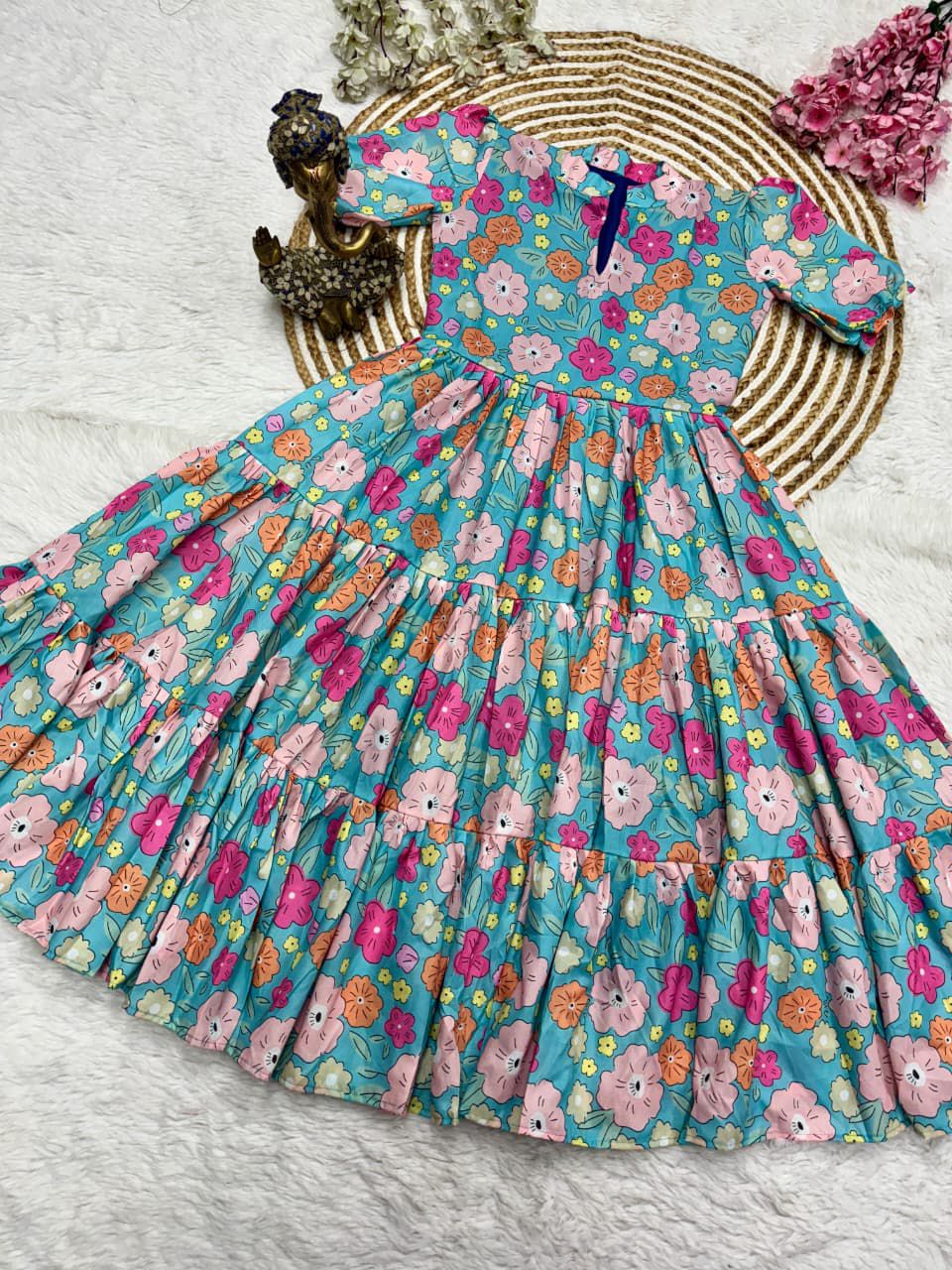 Floral dress with teddy bear pattern on a white surface